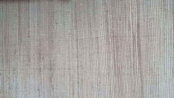 Close-up texture of natural banana fiber, compared against synthetic Kanekalon braiding hair