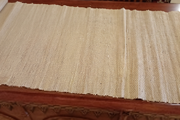 Banana fiber raw material processed into fabric, representing the ecosystem of end products it can support